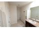 Hallway with a vanity, sink, cabinets, and multiple doors at 11517 Koti Creek Ln, Thonotosassa, FL 33592