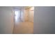 Bright hallway with neutral tile flooring and white doors leading to rooms at 11517 Koti Creek Ln, Thonotosassa, FL 33592