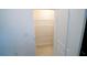 Walk-in pantry with ample shelving for organized storage, complemented by neutral tile flooring at 11517 Koti Creek Ln, Thonotosassa, FL 33592