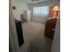 Bright bedroom with carpeted floors, white walls, and ample closet space at 11720 Park Blvd # 104, Seminole, FL 33772