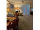 Comfortable living room featuring carpeted floors, overhead lighting, and a tan-colored sofa at 11720 Park Blvd # 104, Seminole, FL 33772
