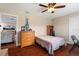 Bedroom featuring light walls, dark hardwood floors, and ceiling fan at 11803 70Th St, Largo, FL 33773