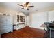 Bedroom with hardwood floors, ceiling fan, and built in storage at 11803 70Th St, Largo, FL 33773