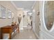 Inviting foyer featuring neutral paint, a table with mirror, decor, and views of the home at 11803 70Th St, Largo, FL 33773