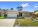 Charming single Gathering home with a well manicured front lawn and a two car garage at 11803 70Th St, Largo, FL 33773