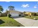 Charming single Gathering home with a large front lawn and a two car garage at 11803 70Th St, Largo, FL 33773