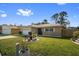 Charming single Gathering home with a well manicured front lawn and a two car garage at 11803 70Th St, Largo, FL 33773
