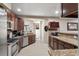 This is a beautiful kitchen with stainless steel appliances and granite counter tops at 11803 70Th St, Largo, FL 33773