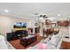 Cozy living room with a plush sectional sofa, perfect for relaxing and entertaining at 11803 70Th St, Largo, FL 33773