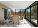 Screened-in patio featuring tile floors and a table with six chairs at 11803 70Th St, Largo, FL 33773