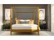 Inviting bedroom with a four-poster bed, neutral decor, and soft lighting at 12553 Lily Quartz Loop, Parrish, FL 34219