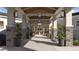 An inviting covered entrance welcomes visitors with stone accents, modern lighting, and verdant plants at 12553 Lily Quartz Loop, Parrish, FL 34219
