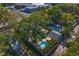 An aerial view of the property highlighting the in-ground pool and landscaped backyard at 145 38Th Ne Ave, St Petersburg, FL 33704