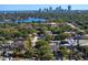 Panoramic aerial view captures a residential community surrounded by lush greenery and sparkling waters with a city skyline backdrop at 145 38Th Ne Ave, St Petersburg, FL 33704