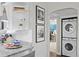Bright kitchen nook features extra cabinet space, wall art and adjoins the laundry area at 145 38Th Ne Ave, St Petersburg, FL 33704