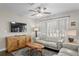 Comfortable living room featuring a ceiling fan, modern furniture, and lots of natural light at 145 38Th Ne Ave, St Petersburg, FL 33704