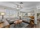 Inviting living room showcasing hardwood floors, comfortable seating, and abundant natural light at 145 38Th Ne Ave, St Petersburg, FL 33704