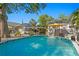 Inviting backyard swimming pool surrounded by lush landscaping and mature trees at 145 38Th Ne Ave, St Petersburg, FL 33704
