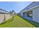 A well-maintained backyard features green grass, a fence, and a patio area for outdoor living at 1504 Colt Creek Pl, Wesley Chapel, FL 33543