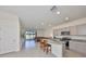 Bright kitchen featuring stainless steel appliances, granite counters, an island with seating, and sliding glass doors to the yard at 1504 Colt Creek Pl, Wesley Chapel, FL 33543