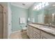 Well-lit bathroom featuring double sinks, granite counters and tile flooring at 16331 Treasure Point Dr, Wimauma, FL 33598