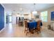 Dining area open to kitchen with stainless appliances and ample counter space at 16331 Treasure Point Dr, Wimauma, FL 33598