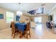 Dining area with chandelier lighting and views of the living room at 16331 Treasure Point Dr, Wimauma, FL 33598
