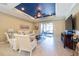 Living area featuring comfortable seating and sliding glass doors to the lanai at 16331 Treasure Point Dr, Wimauma, FL 33598