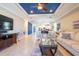 Spacious living room open to dining and kitchen, featuring bright décor at 16331 Treasure Point Dr, Wimauma, FL 33598