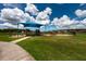 Community playground with slides, swings, and a shaded picnic area, perfect for families to enjoy outdoor activities at 16331 Treasure Point Dr, Wimauma, FL 33598