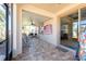 Covered porch with a brick floor, ceiling fan, and outdoor seating area at 16331 Treasure Point Dr, Wimauma, FL 33598