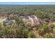 An aerial view of the neighborhood showing tree coverage and the home's location at 16340 Marquis Rd, Brooksville, FL 34614