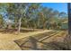 Expansive backyard with lush greenery and mature trees offering serene privacy at 16340 Marquis Rd, Brooksville, FL 34614
