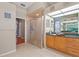 Bathroom featuring a stand up shower, granite counters, and tile floors at 16340 Marquis Rd, Brooksville, FL 34614