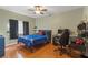 A bedroom featuring hardwood flooring, a ceiling fan, and a desk setup at 16340 Marquis Rd, Brooksville, FL 34614