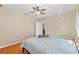 Bedroom with ceiling fan, hardwood floors, and bright natural light at 16340 Marquis Rd, Brooksville, FL 34614