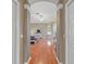 Bedroom view with hardwood floors leading to a comfy bed, dresser, and lots of natural light at 16340 Marquis Rd, Brooksville, FL 34614