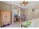 Cozy bedroom featuring decorative accents and arched windows at 16340 Marquis Rd, Brooksville, FL 34614