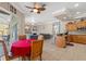 A kitchen, dining, and living area with tile floors, wooden cabinets, and modern appliances at 16340 Marquis Rd, Brooksville, FL 34614