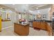 Open kitchen design with a central island, stainless steel appliances, and views to dining area at 16340 Marquis Rd, Brooksville, FL 34614