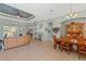 Open layout of the home's living and dining areas featuring tile floors and access to the outdoors at 16340 Marquis Rd, Brooksville, FL 34614