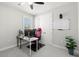 Bedroom featuring desk, chair, and natural light at 17915 Barn Close Dr, Lutz, FL 33559