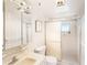 Clean bathroom with a glass shower door, tiled walls, and bright lighting at 1900 59Th N Ave # 217, St Petersburg, FL 33714