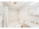 Well-lit bathroom features a tub, shower, and modern vanity at 1900 59Th N Ave # 217, St Petersburg, FL 33714