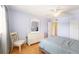 Bright bedroom with ceiling fan has a large window and adjacent doorway at 1900 59Th N Ave # 217, St Petersburg, FL 33714