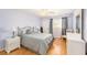 Bright bedroom with a ceiling fan, wood floors and a large window at 1900 59Th N Ave # 217, St Petersburg, FL 33714