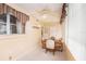 Bright dining area features a ceiling fan, window and access to kitchen at 1900 59Th N Ave # 217, St Petersburg, FL 33714