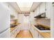 Efficient kitchen features ample cabinetry, wood countertops, and modern appliances at 1900 59Th N Ave # 217, St Petersburg, FL 33714