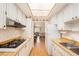 Functional kitchen with wood countertops, ample storage, and a view into the living area at 1900 59Th N Ave # 217, St Petersburg, FL 33714
