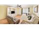 Inviting living room features hardwood floors, a large built-in, and comfortable furniture at 1900 59Th N Ave # 217, St Petersburg, FL 33714